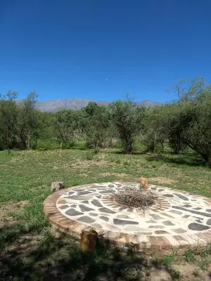 a stone circle in the middle of a field at Tacko Huasi in San Javier