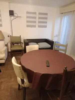 a living room with a table and a couch at Confortable en Cofico in Cordoba