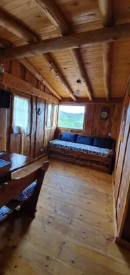 a room with a couch in the inside of a bus at Cabañas La Escondida Casa De campo in San Antonio de Arredondo