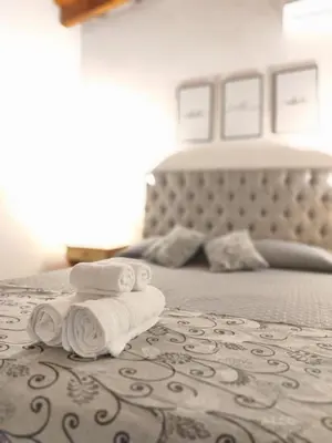 a bedroom with a bed with two towels on it at Complejo Boulevard in Villa Ciudad de America