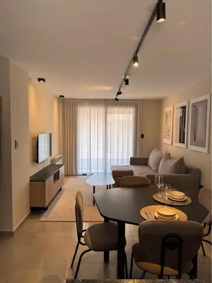 a living room with a couch and a table at Faz Hostel Boutique in Cordoba