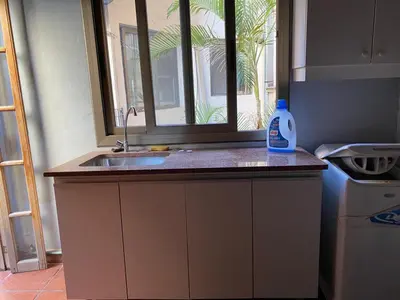 a kitchen counter with a sink and a window at categoria a 1 cuadra plaza espana in Cordoba