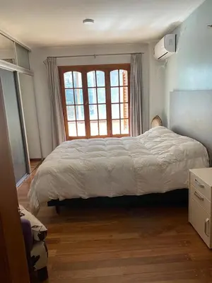 a bedroom with a large bed and a window at categoria a 1 cuadra plaza espana in Cordoba