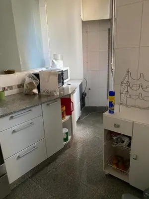 a kitchen with white cabinets and a counter top at categoria a 1 cuadra plaza espana in Cordoba