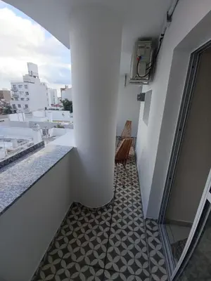a balcony with a bench on a building at Cofico Ideal in Cordoba