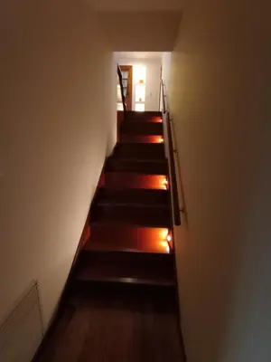a stairway leading up to a room with a hallway at Casa Lucerna in Cordoba