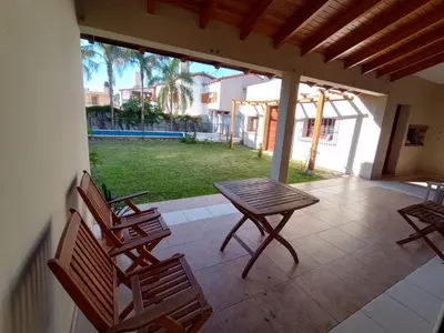 a patio with a table and chairs on a porch at Casa Lucerna in Cordoba
