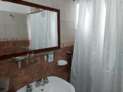 a bathroom with a sink and a mirror at Espejo de Hadas - Terrafirme in Villa Yacanto