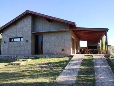 a house with a pathway leading up to it at HolaViajerosVGB in Villa General Belgrano