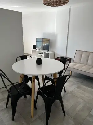 a white table and chairs in a living room at Cba Rent in Cordoba