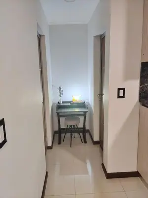 a hallway with a piano in a room at Apartamento Carlos Paz in Villa Carlos Paz