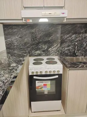 a stove in a kitchen with a counter top at Apartamento Carlos Paz in Villa Carlos Paz