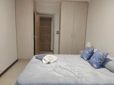 a bedroom with a bed with two towels on it at Apartamento Carlos Paz in Villa Carlos Paz