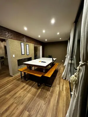 a large room with a ping pong table in it at Casa Las Magnolias Villa General Belgrano in Villa General Belgrano