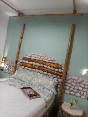 a bed in a room with two wooden bunk beds at Aldea Granpas in Embalse
