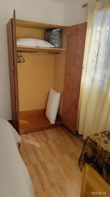 a small room with a bed and a room with a bunk bed at Makipura in Cordoba