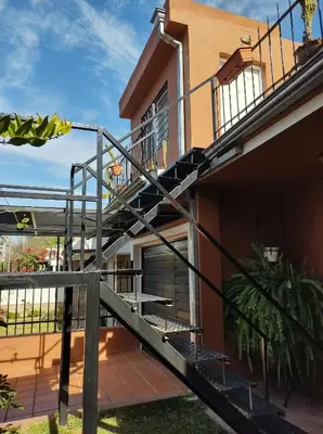 a staircase leading up to a house at Makipura in Cordoba