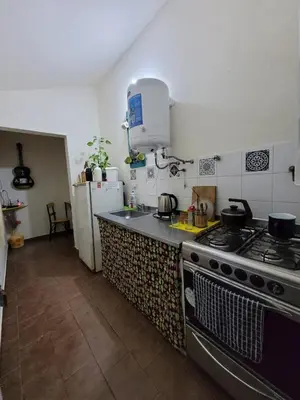 a kitchen with a stove and a counter top at Doña Vanina in Villa Larca