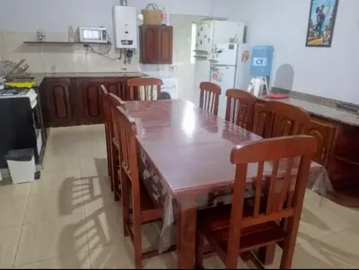 a kitchen with a large wooden table and chairs at Casa en Las Tapias cerca de Villa de Las Rosas in San Javier