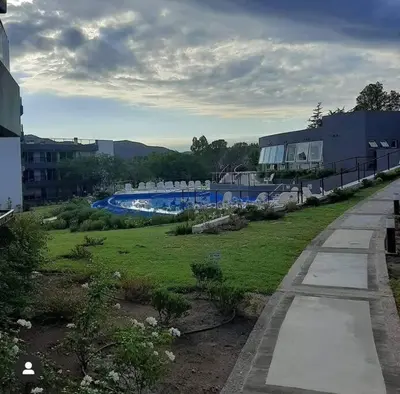 a view of a swimming pool in a park at Departamento con vista al lago en Veneto Village in Villa Parque Siquiman