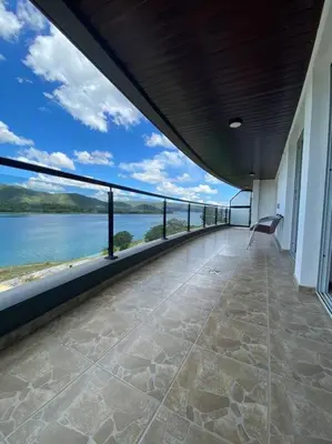 a balcony of a building with a view of the water at Departamento con vista al lago en Veneto Village in Villa Parque Siquiman