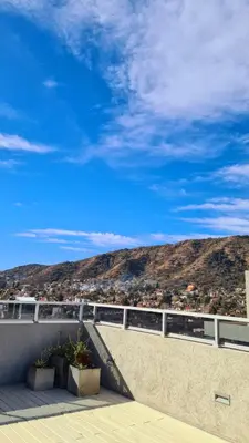a balcony with a view of a mountain at Opera Villa Carlos Paz- Moderno - exclusivo- La mejor ubicación in Villa Carlos Paz