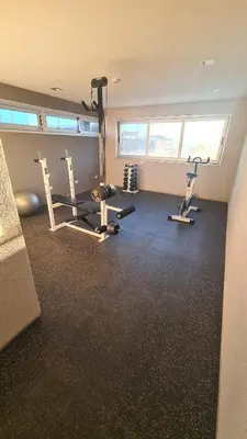 a gym with two treadmills and two exercise bikes at Opera Villa Carlos Paz- Moderno - exclusivo- La mejor ubicación in Villa Carlos Paz