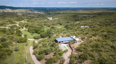 an aerial view of a house in the woods at Casa de campo in Villa San Nicolás