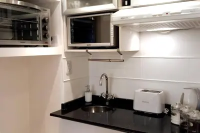 a kitchen with a sink and a toaster at Dpto Temporario Córdoba, ubicación ideal in Cordoba