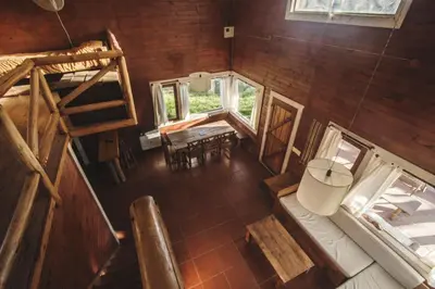 an overhead view of a room with a table and chairs at Cabañas Cuatro Horizontes in Villa General Belgrano