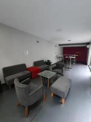 a living room with couches and chairs and a table at Cañas Suites Urbanas in Mina Clavero