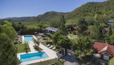 an aerial view of a resort with a swimming pool at Aldea de los Pajaros in Villa General Belgrano