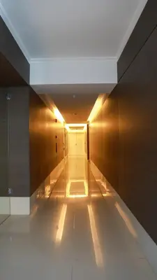 a hallway of a building with a light on the ceiling at Apart France - Con Gim, Piscina y estacionamiento - Matrimonial in Río Cuarto