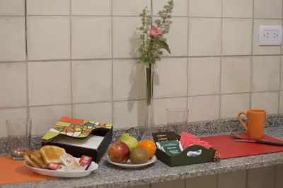 a table with two plates of food on a counter at Luna de Alberdi Apart in Cordoba