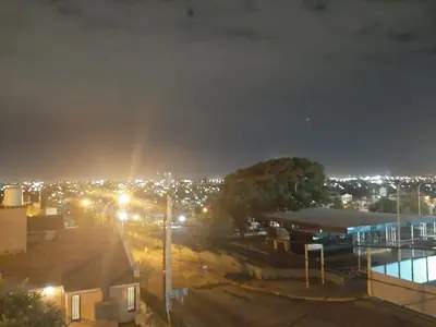 a view of a city at night with lights at ALTOS DE VILLA CABRERA in Cordoba