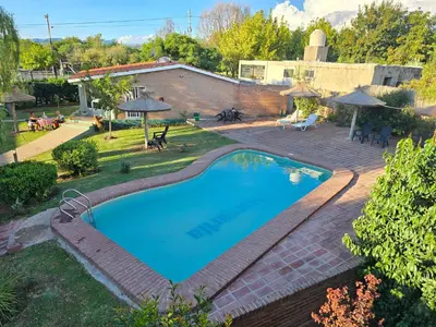 an overhead view of a swimming pool in a yard at La Margarita Lofts - Solo 2 Adultos in Mina Clavero