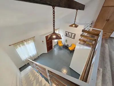 an overhead view of a living room with a staircase at La Margarita Lofts - Solo 2 Adultos in Mina Clavero