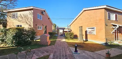 a brick walkway in front of a house at La Margarita Lofts - Solo 2 Adultos in Mina Clavero