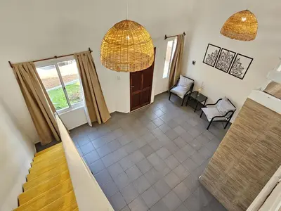 an aerial view of a living room with a staircase at La Margarita Lofts - Solo 2 Adultos in Mina Clavero