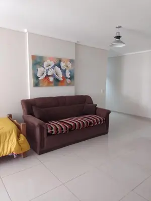 a brown couch sitting in a living room at Departamento en Nueva Córdoba - Patagonia 7 in Cordoba