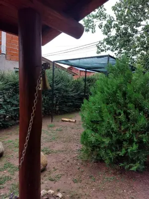 a porch with a chain hanging from a wooden post at Azul in Arroyo de Los Patos