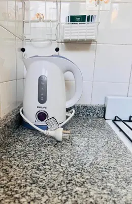 a toaster sitting on a counter in a kitchen at Luminoso departamento con vista! in Cordoba