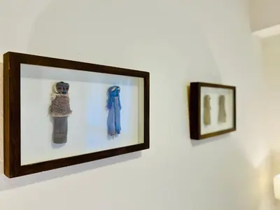 a picture on a wall with two framed pictures at Luminoso departamento con vista! in Cordoba