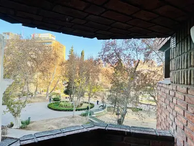 a view of a park from a brick building at Luminoso departamento con vista! in Cordoba