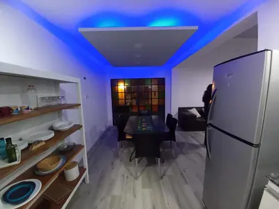 a kitchen with a blue ceiling and a refrigerator at CASA CONFORTABLE II in Cordoba