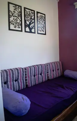 a couch with a blanket on it in a room at Monteolivos II in El Rincón