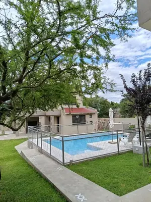 a swimming pool in front of a house at Monteolivos II in El Rincón