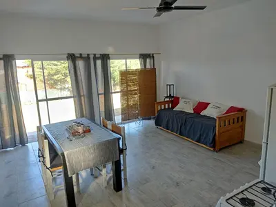 a bedroom with a bed and a table in it at Villa Aurora in Potrero de Garay