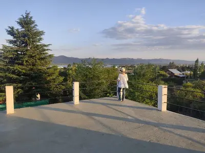 a woman walking on a bridge with a dog at Villa Aurora in Potrero de Garay