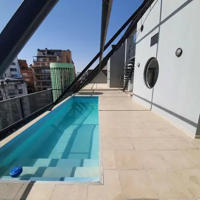 a swimming pool on the roof of a building at LOAN Nueva Cordoba 6A in Cordoba
